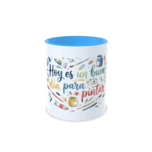 Taza de cerámica sobre pintura y arte con frase Hoy es un buen día para pintar en caligrafía e ilustraciones de acuarela, interior en color azul claro, vista frontal centrada.